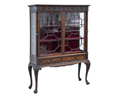 An Edwardian&nbsp; mahogany chippendale revival cabinet, early 20th c, with blind fret carved frieze and drawers, the pair of