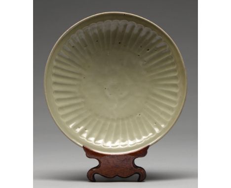 A Swatow Ware dish, Ming dynasty, of fluted form, unglazed inside the foot ring, 28cm diam&nbsp;&nbsp;  Provenance: Collectio