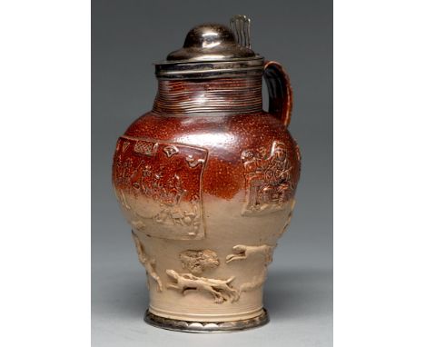 A silver mounted Mortlake saltglazed brown stoneware hunting jug, c1790, the sprigged decoration including a central plaque o