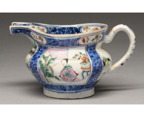A Chinese underglaze blue and famille rose milk jug, early 19th c, enamelled with square panels of a lady or other figures, a