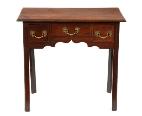 A George III oak lowboy, fitted three cockbeaded drawers to the ogee arched kneehole, on chamfered legs, 70cm h; 45 x 78cm Ha