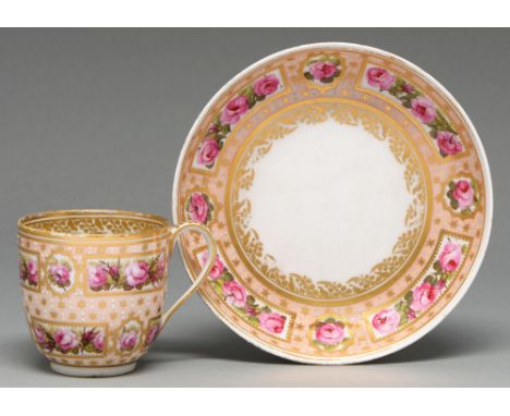 A Derby coffee cup and saucer, c1795, painted with reserves of roses on a salmon pink ground, saucer 14cm diam, puce painted 