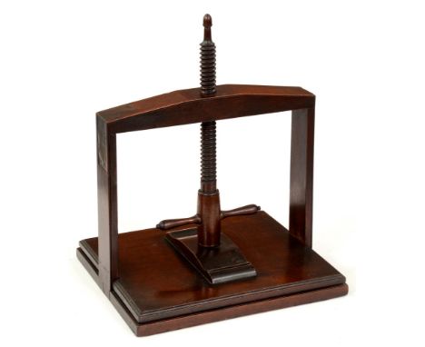 A George III mahogany book press, the frame with two flush brass corner brackets, mahogany helix with acorn finial, 42cm h, b