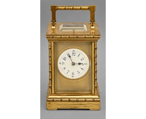 A French brass carriage clock, c1900, the enamel dial with blue chapters and blued steel hands,&nbsp; engine turned brass mas