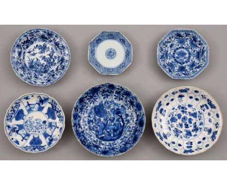 Six Chinese blue and white saucers, Kangxi period, one petal-moulded, each painted with a different pattern, on four also on 