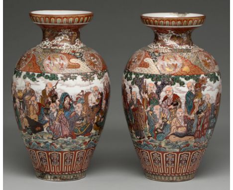 A pair of Japanese earthenware vases, early 20th c, enamelled with a continuous scene of Sennins and a Shishi, the shoulder w