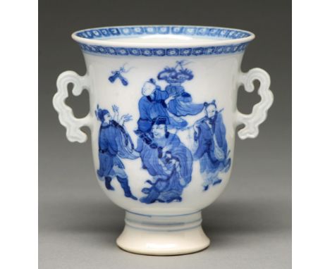 A Chinese blue and white cup, probably 19th c, bell shaped with cloud handles and painted with immortals beneath diaper borde