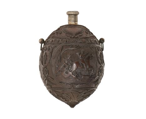 A coconut flask,&nbsp; probably French, 18th c, crisply carved with three hunting scenes in circular frames, the grotesque bu