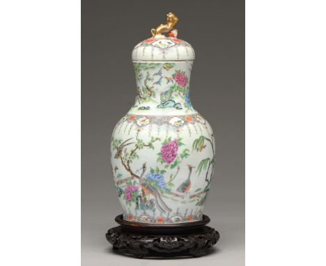 A Chinese Canton famille rose vase and cover, 19th c, enamelled with peafowl and other birds, magnolia and peony, the lavende