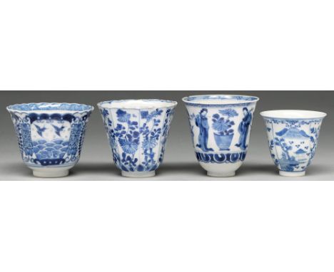 A Chinese blue and white octagonal beaker, Kangxi period, painted in upright registers with flowering plants, 80mm h, flower 