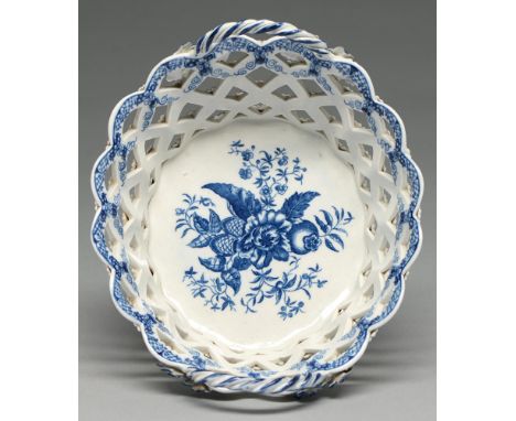 A Worcester blue and white pierced basket, c1775, transfer printed with the Pinecone pattern, 22.5cm l, hatched crescent in u