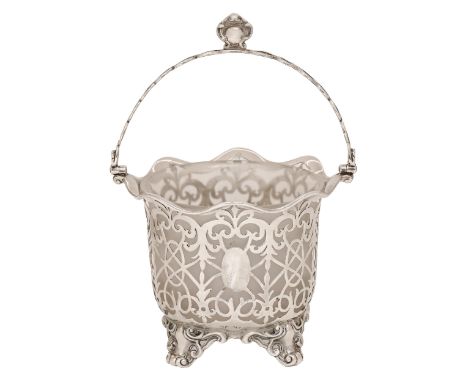 A Victorian silver openwork sugar basket, the annular bowl pierced with tracery, oval paterae and formal scrolls beneath an e