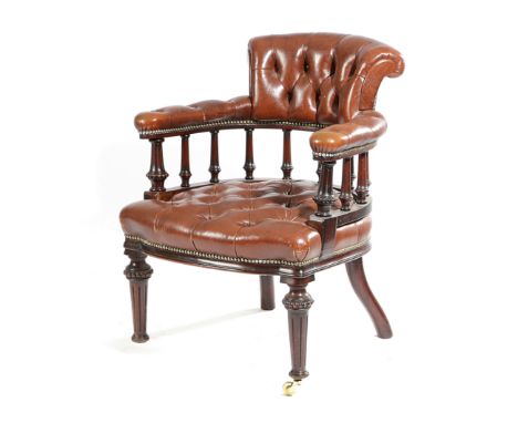 A LATE VICTORIAN MAHOGANY AND LEATHER TUB DESK CHAIR LATE 19TH CENTURY button upholstered and on fluted supports Provenance F