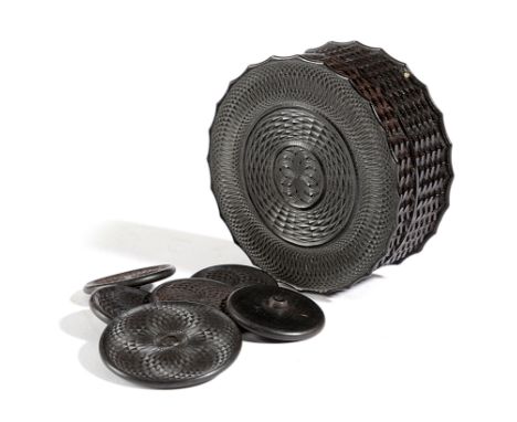 A VICTORIAN TREEN ENGINE TURNED EBONY BOX MID-19TH CENTURY containing six ebony engine turned buttons (7) 7.5cm diameter Prov