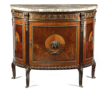 A FRENCH MAHOGANY AND KINGWOOD COMMODE IN TRANSITIONAL STYLE LATE 19TH / EARLY 20TH CENTURY with ormolu mounts, the mottled g