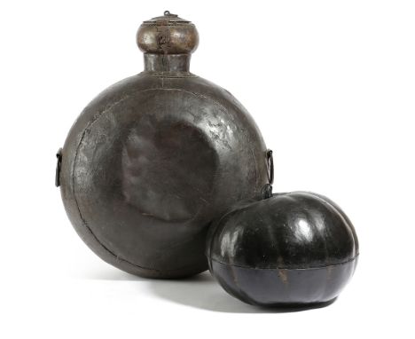 AN ORIENTAL BLACK LACQUERED PUMPKIN BOX 20TH CENTURY together with an Islamic copper flask (2) 57.5cm high (max) Provenance F