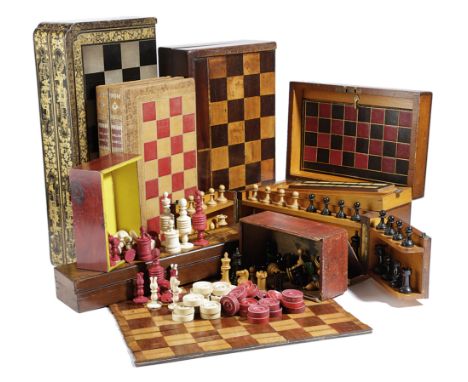 A COLLECTION OF CHESS SETS AND GAME BOARDS 19TH CENTURY AND LATER comprising: a boxwood and ebony Staunton pattern chess set 