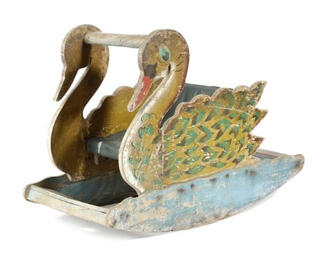 A FOLK ART PAINTED WOOD CHILD'S ROCKING CHAIR FIRST HALF 20TH CENTURY in the form of a swan, with a Rexine seat 48.8cm high, 