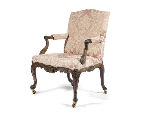 A GEORGE II MAHOGANY LIBRARY ARMCHAIR ATTRIBUTED TO PAUL SAUNDERS, C.1755-60 the padded arched back, serpentine seat and armr