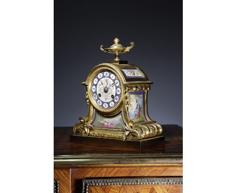 A FRENCH ORMOLU AND PORCELAIN MANTEL CLOCK IN LOUIS XVI STYLE LATE 19TH CENTURY the brass eight day drum movement striking on