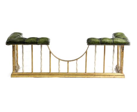 A GILT METAL CLUB FENDER 20TH CENTURY with button upholstered green leather seats and a railed front 53.2cm high, 154cm wide,