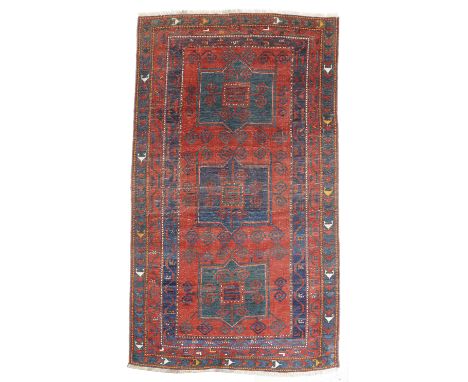 A KAZAK RUG SOUTH WEST CAUCASUS, FIRST HALF 20TH CENTURY with triple medallions 273 x 166cm