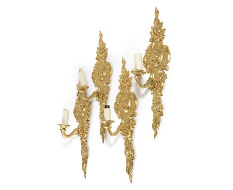 A SET OF FOUR ORMOLU WALL LIGHTS IN ROCOCO STYLE 20TH CENTURY each with a single light, the backplate decorated with scrolls 