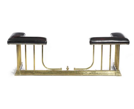 A BRASS ADJUSTABLE CLUB FENDER FIRST HALF 20TH CENTURY with leather seats and with railed supports 47.8cm high, 145cm wide, 4