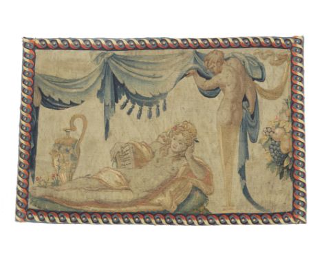 A FRENCH TAPESTRY FRAGMENT PARIS, MID-16TH CENTURY worked with a scantily clad maiden or muse, reclining on a daybed and hold