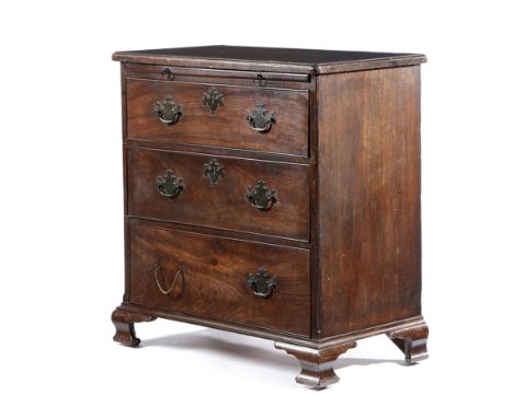 AN EARLY GEORGE III MAHOGANY BACHELOR'S CHEST C.1760-70 the crossbanded top with a caddy moulded edge, above a brushing slide
