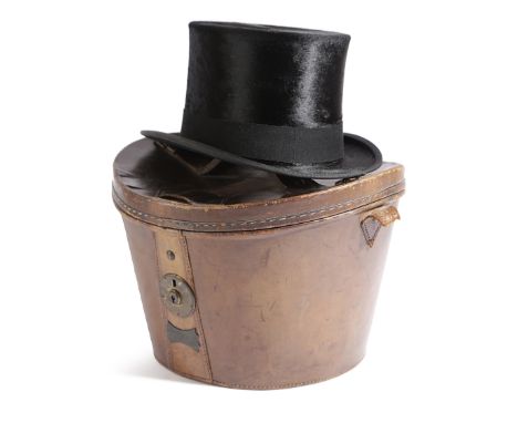 A BLACK SILK TOP HAT BY G. A. DUNN &amp; CO., FIRST HALF 20TH CENTURY with maker's mark, contained within a brown leather buc