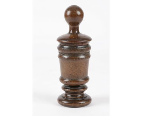 A TREEN FRUITWOOD MORTAR GRATER 18TH CENTURY in two parts, with a turned pestle handle, revealing two pierced metal grating p