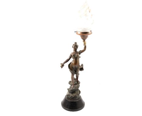 Continental spelter table lamp, formed as a Maiden holding a frosted glass flame shade, tapering conical base, as found, over
