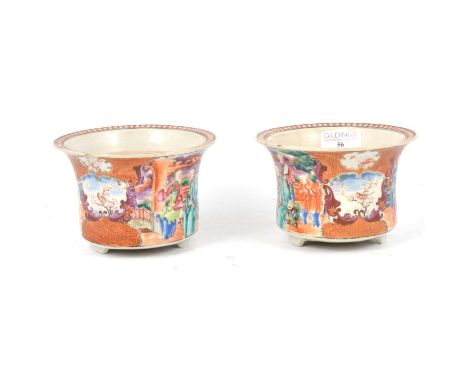 Pair of Chinese porcelain cache pots, flared form, painted with figures in famille rose enamels, tripod feet, unmarked, 9.5cm