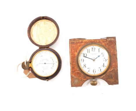 Hutchinsons Improved Surveying aneroid pocket barometer, diameter 5cm, cased; and a travel clock, casing defective.Qty: 2