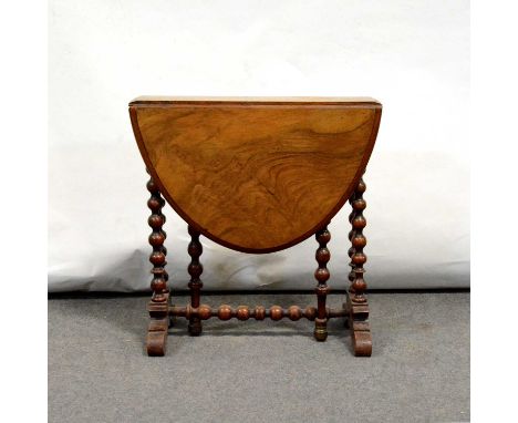 Victorian walnut Sutherland table, oval top, bobbin-turned supports, scrolled feet, 55x74cm, height 56cm.Condition report:Whe