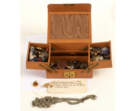 A Victorian yellow metal mourning locket, marked 'In Memory of OS 1863' in black enamel, containing a photo and woven hair, a