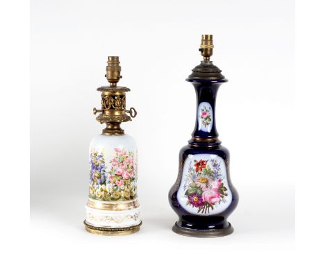 A Victorian opaline glass oil lamp, painted with flowers and another Victorian opaline glass lamp, foliate painted on a blue 