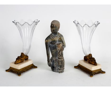 A statue of a tribal woman in carved and polished stone, R Karilka, 24cm high (damaged) and a pair of glass cornucopia vases 