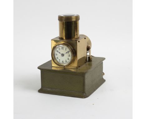 An Edwardian ceiling projector clock or brothel clock, the circular dial with Roman numerals to a green leather box base/Prov