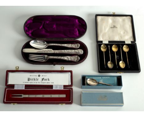 A Victorian silver three-piece Christening set of knife, fork and spoon, a cased silver pickle fork, five silver and enamel c