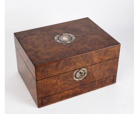 A mid 19th Century burr walnut and mother-of-pearl inlaid dressing case, the fitted interior with glass jars etc.