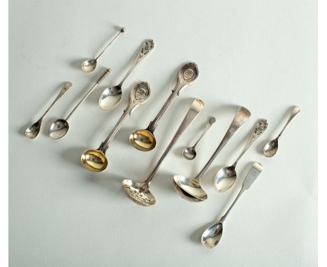 A silver sauce ladle, a sugar sifter spoon and various condiment spoons