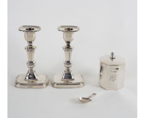 A pair of 18th Century style silver candlesticks, Sheffield 1922, weighted, 16cm high, an octagonal tea caddy, Walker &amp; H