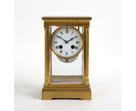 A gilt brass cased four-glass clock, the enamel dial with Roman numerals, fitted a French cylinder movement, 25.5cm high