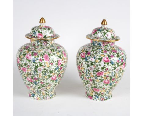 A pair Crown Staffordshire jars and covers with floral decoration, Reg no: 622 733, 30cm high  CONDITION REPORT: One vase fai