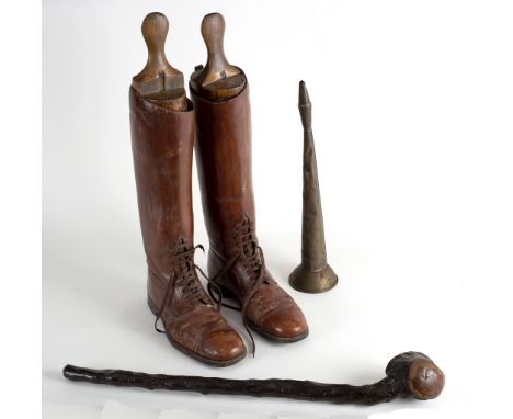 A pair of brown leather riding boots with lace up fronts, a brass horn by R Smith, Yarmouth and a knobkerrie/Provenance: The 