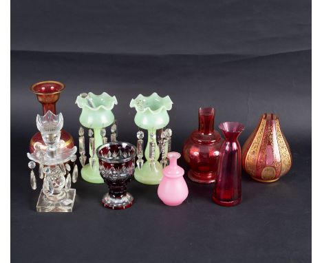 A Victorian cut glass lustre candlestick hung with prismatic drops, 24cm high and eight pieces of coloured glass
