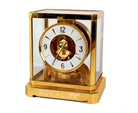 An Atmos clock by Jaeger-LeCoultre, in a gilt brass case with glazed top and sides, 23.5cm high/see illustration CONDITION RE