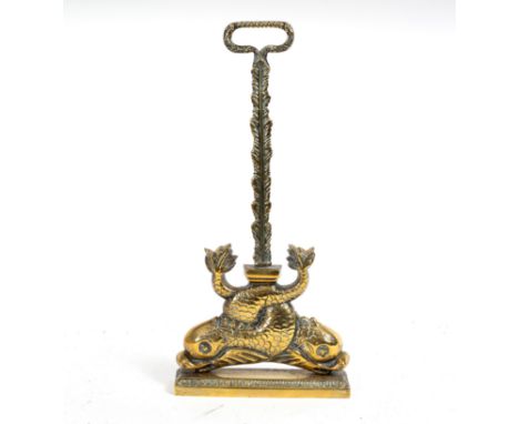 A brass door porter modelled as entwined dolphins, 47cm high